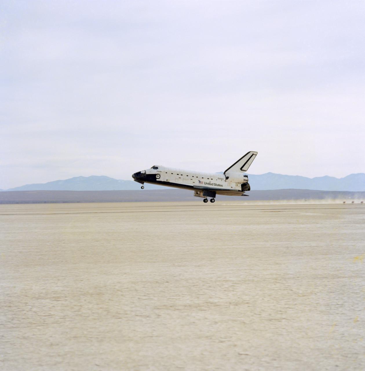 STS044-S-140 (1 Dec 1991) --- A wide shot of Atlantis, with a crew of six aboard, as it is about to touch down at Edwards Air Force Base in southern California.  Main gear touchdown occurred at 2:34:42 p.m. (PST), December 1, 1991.