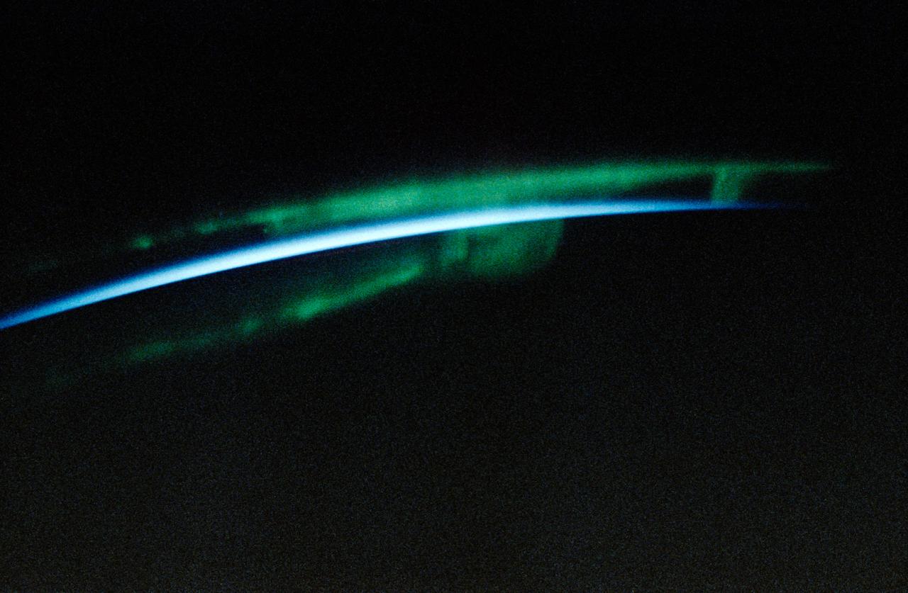 STS-45 Earth observation taken onboard Atlantis, Orbiter Vehicle (OV) 104, is of the Aurora Australis or Southern Lights. The green appearing auroral activity engulfs the thin blue line on the Earth's limb. Aurorae were observed and photographed throughout the STS-45 nine-day mission.