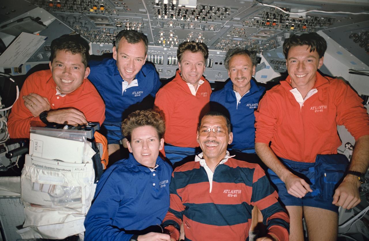 STS045-38-004 (24 March-2 April 1992)  --- The traditional inflight crew portrait has Kathryn D. Sullivan, payload commander,  and Charles F. Bolden, mission commander, on the front row, with ( left to right) David C. Leestma, mission specialist; Brian Duffy, pilot; Byron K. Lichtenberg and Dirk Frimout, both payload specialists; and C. Michael Foale, mission specialist, on the back row.  (The "headpieces" worn by Sullivan and Bolden are actually shadows.)  This frame was taken with a 35mm camera on the flight deck of the Earth-orbiting Space Shuttle Atlantis during the nine-day mission.