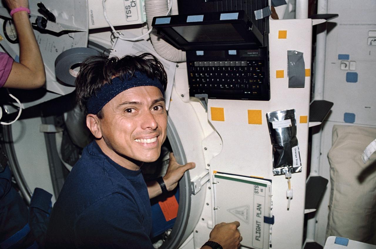 STS046-24-009 (31 July-8 Aug 1992) --- Astronaut Franklin R. Chang-Diaz, mission specialist, prepares to input data on the personal general support computer on the middeck of the Space Shuttle Atlantis as it makes one of its 127 total orbits for the eight-day mission.  Chang-Diaz, wearing a headband, joined four other NASA astronauts and two European scientists for the mission.