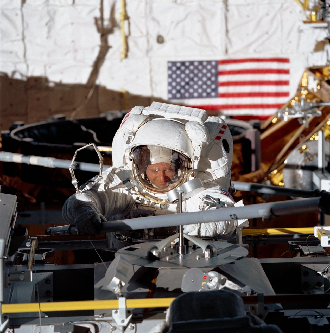 STS049-77-028 (14 May 1992) --- Astronaut Thomas D. Akers, STS-49 mission specialist, grabs a strut device as fourth period of extravehicular activity (EVA) gets underway in the Space Shuttle Endeavour's cargo bay. Akers is positioned near the Multi-purpose Support Structure (MPESS). The purpose of the final EVA on this nine-day mission was the evaluation of Assembly of Station by EVA Methods (ASEM). The scene was recorded on 70mm film by a fellow crew member in the space shuttle's cabin. Astronaut Kathryn C. Thornton (out of frame) joined Akers on the 7 1/2 hour EVA.