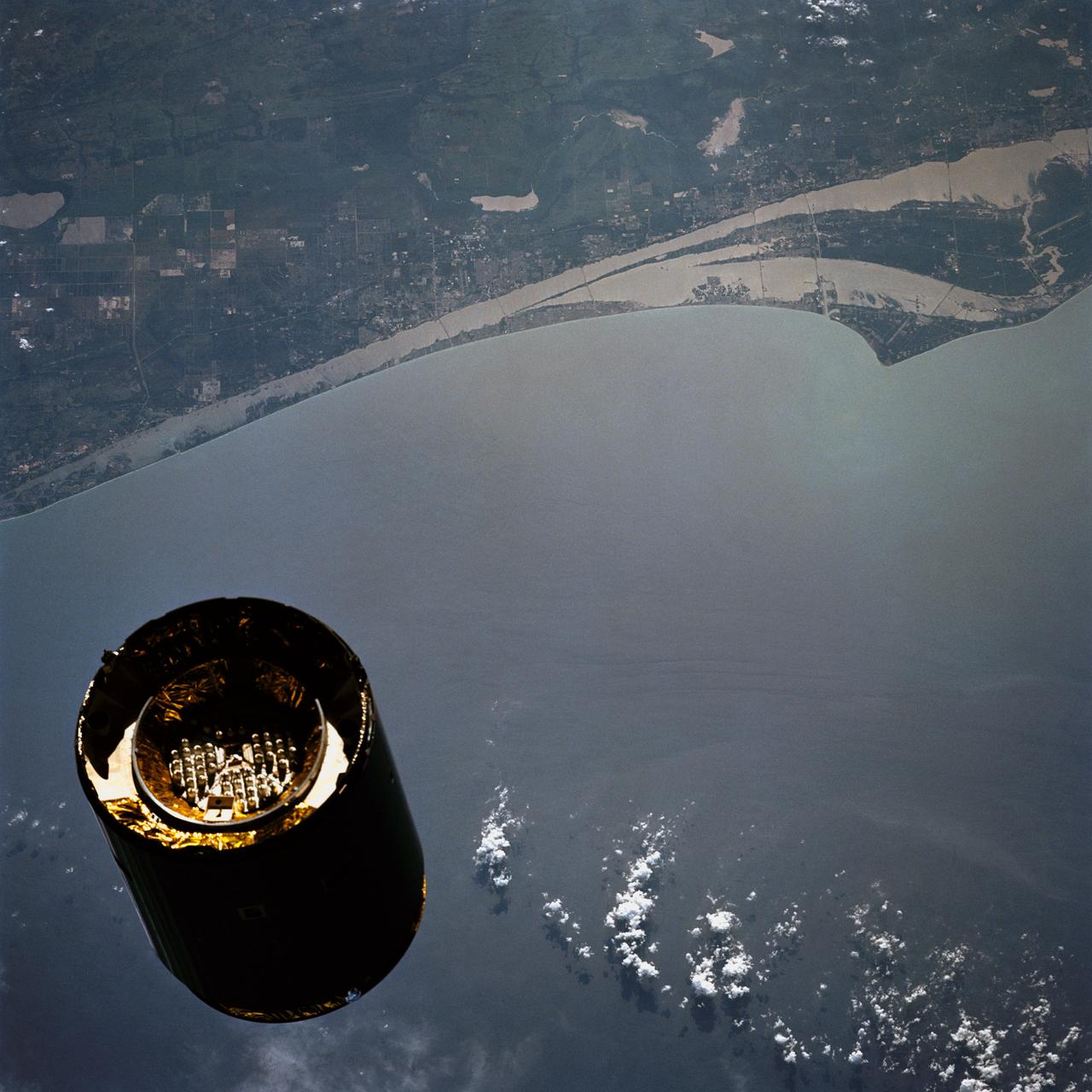 STS049-79-024 (13 May 1992) --- Florida's Atlantic Coast and the Cape Canaveral area form the backdrop for this 70mm scene of Intelsat VI's approach to the Space Shuttle Endeavour. Later, the seven-member crew was successful in capturing the satellite and adding a perigee phase. The new motor allowed the needed boost for Intelsat, once the crew members had released it into space.