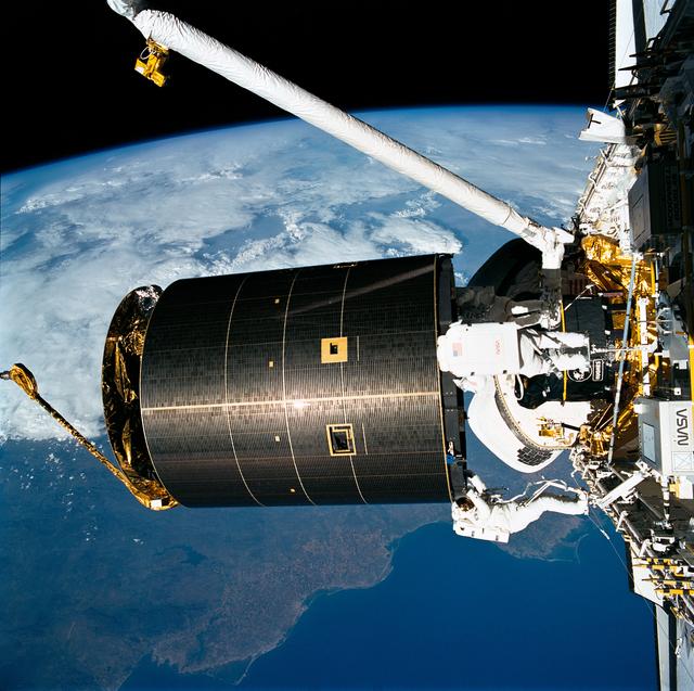 NASA image: STS-49 crew captures INTELSAT VI above OV-105's payload bay (PLB) during EVA