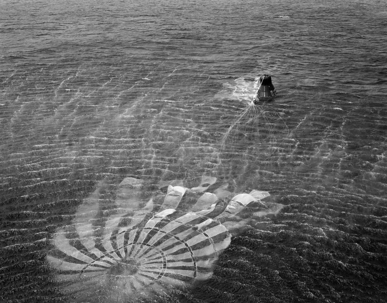 S61-01398 (18 March 1961) --- View of the recovery of the Little Joe-5A spacecraft which lifted off on March 18, 1961 from Wallops Island. The photo was taken from the recovery helicopter and shows the craft's parachute still attached and floating in the water next to the capsule. Little Joe-5A was a suborbital flight to test the Mercury capsule. The escape rocket motor fired prematurely and prior to capsule release. Photo credit: NASA
