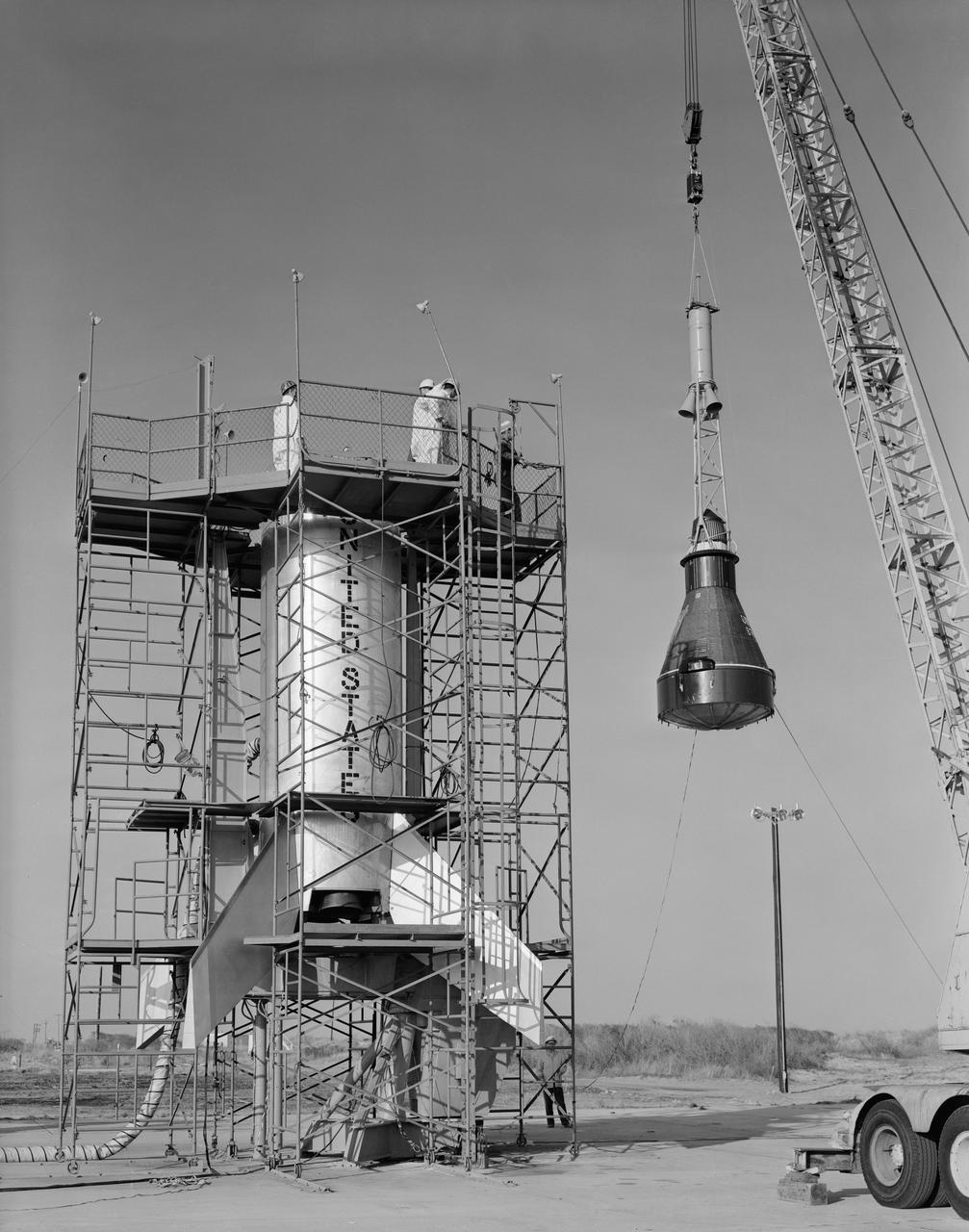 S61-01673 (23 April 1961) --- View of the mating of Little Joe-5B launch vehicle with Mercury capsule #14. Photo credit: NASA