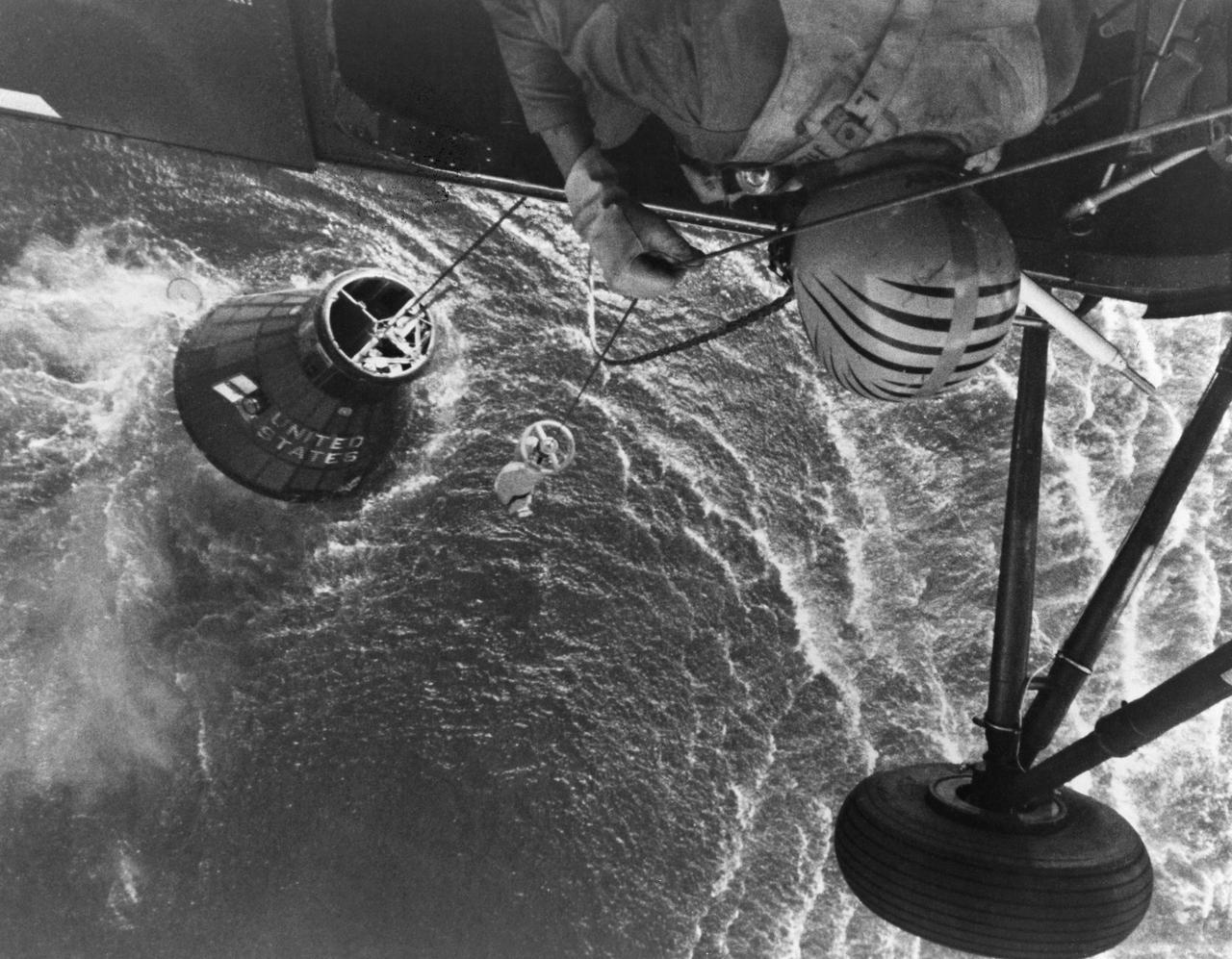 S61-02824 (21 July 1961) --- A U.S. Marine Corps helicopter attempts an unsuccessful recovery of the Mercury-Redstone 4 "Liberty Bell 7" spacecraft. The spacecraft hatch opened prematurely, and astronaut Virgil I. Grissom, pilot, escaped into the water. The helicopter hooked onto the spacecraft but could not retrieve it. Grissom was recovered by another helicopter and flown to the recovery ship, USS Randolph. The Mercury spacecraft sank to the bottom of the ocean. Photo credit: NASA
