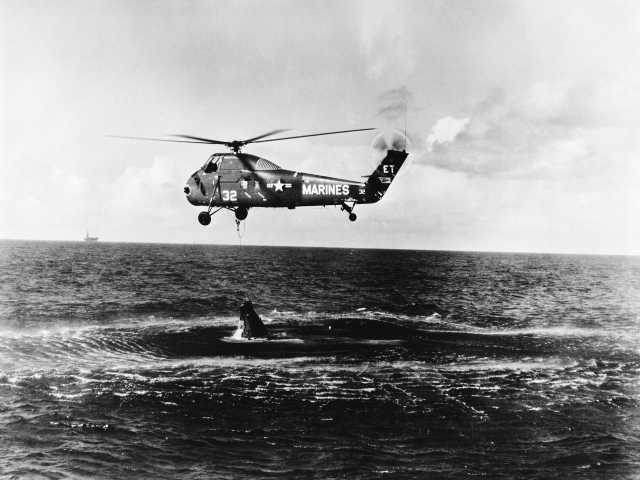 S61-02826 (21 July 1961) --- A U.S. Marine Corps helicopter attempts an unsuccessful recovery of the Mercury-Redstone 4 "Liberty Bell 7" spacecraft. The spacecraft hatch opened prematurely, and astronaut Virgil I. Grissom, pilot, escaped into the water. The helicopter hooked onto the spacecraft but could not retrieve it. Grissom was recovered by another helicopter and flown to the recovery ship, USS Randolph. The Mercury spacecraft sank to the bottom of the ocean. Photo credit: NASA