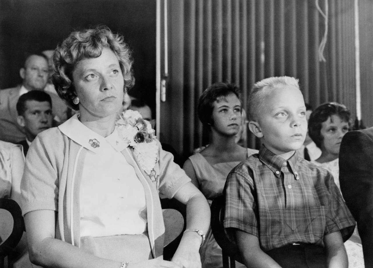 S61-03664 (23 July 1961) --- Astronaut Virgil I. (Gus) Grissom's wife and son watch from the audience as a press conference is held on July 23, 1961 at the Starlight motel. Photo credit: NASA