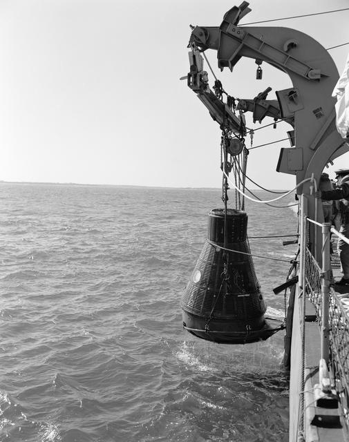 NASA image: Mercury capsule mock-up suspended from ship during water egress training