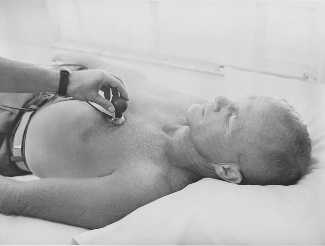 S61-03622 (1961) --- Mercury astronaut John H. Glenn Jr. has a biosensor attached to his body during astronaut training activities at Cape Canaveral, Florida. Photo credit: NASA
