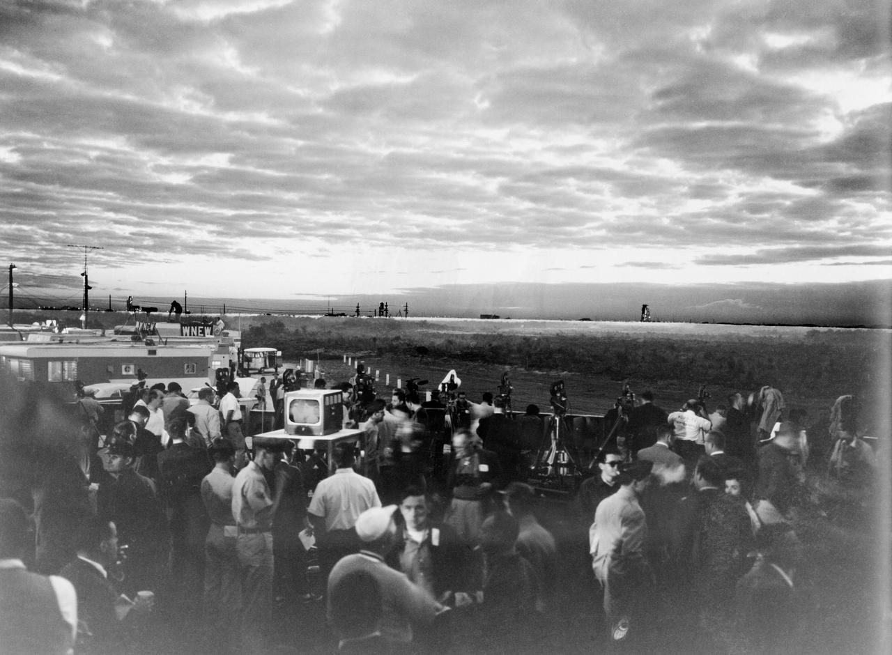 S62-00271 (20 Feb. 1962) --- During the early hours of dawn, newsmen, photographers and T.V. reporters await the Mercury-Atlas 6 (MA-6) liftoff at Cape Canaveral, Florida. Photo credit: NASA