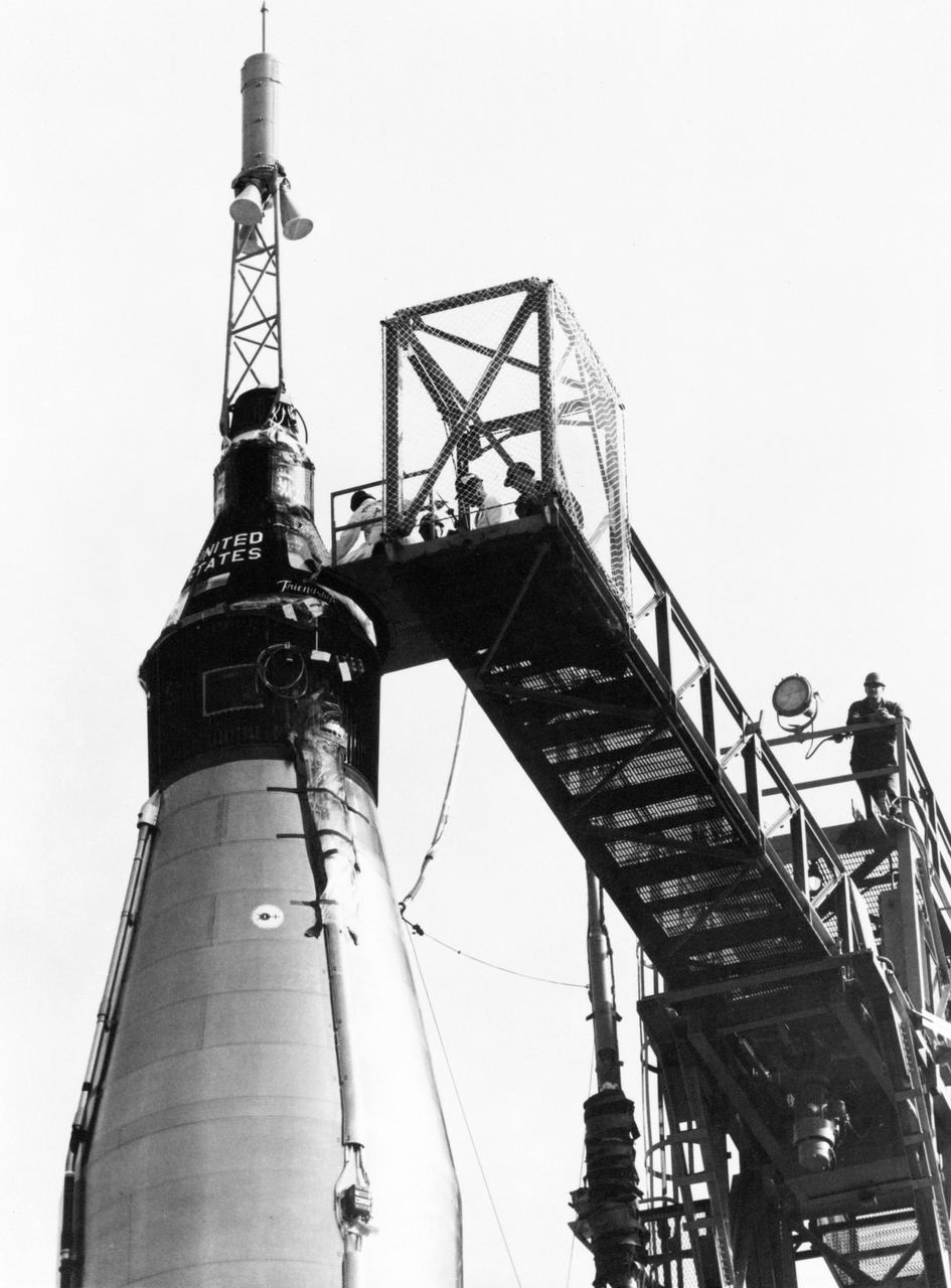 S62-00380 (20 Feb. 1962) --- Close-up view of the Mercury Atlas 6 (MA-6) Friendship 7 capsule on top of its booster rocket with catwalk still attached. Photo credit: NASA