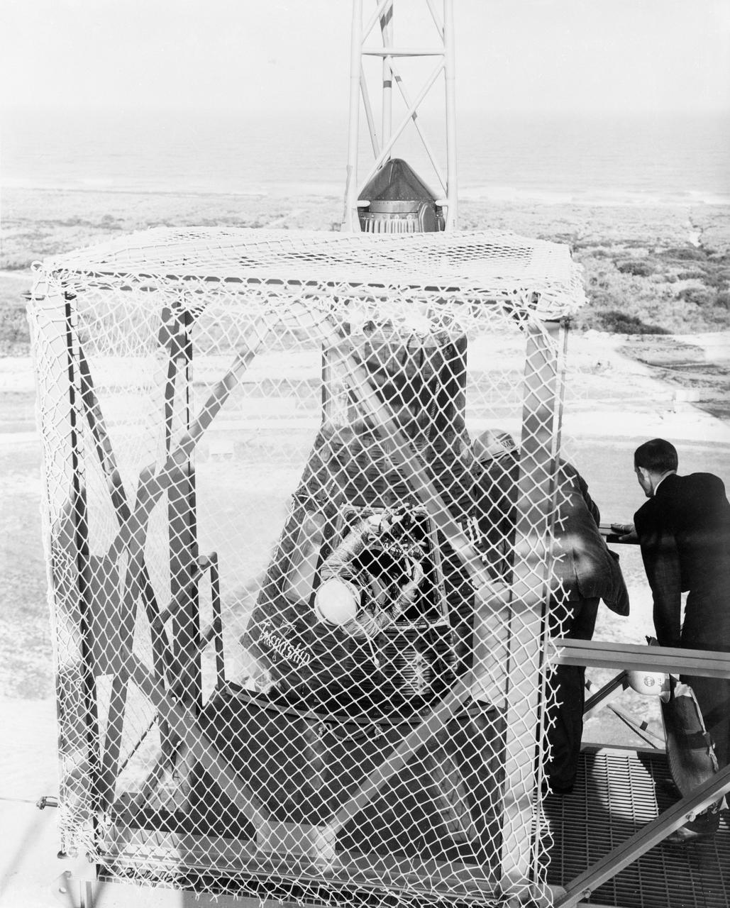 S62-00490 (20 Feb. 1962) --- View of Mercury Atlas 6 (MA-6) Friendship 7 capsule on top of its booster rocket with astronaut John H. Glenn Jr. just visible in the open hatch. Photo credit: NASA
