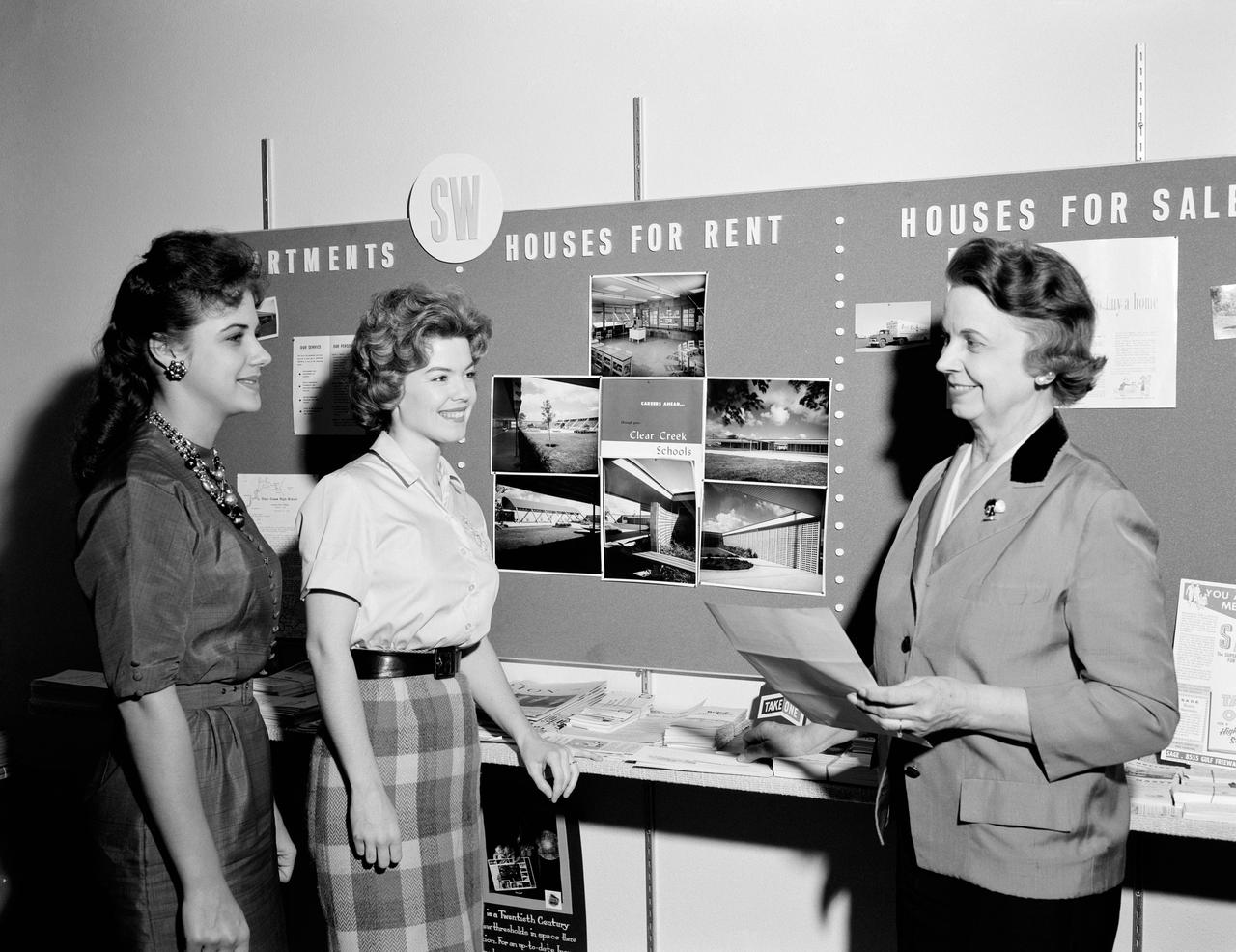 View of personnel looking at announcements concerning apartments for rent at the MSC Re-location Center.