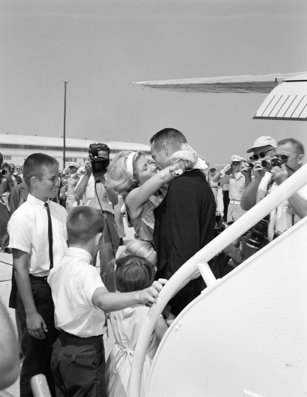 S62-03916 (May 1962) --- The wife and children of astronaut M. Scott Carpenter welcome him after the successful Mercury-Atlas 7 (MA-7) flight. Photo credit: NASA