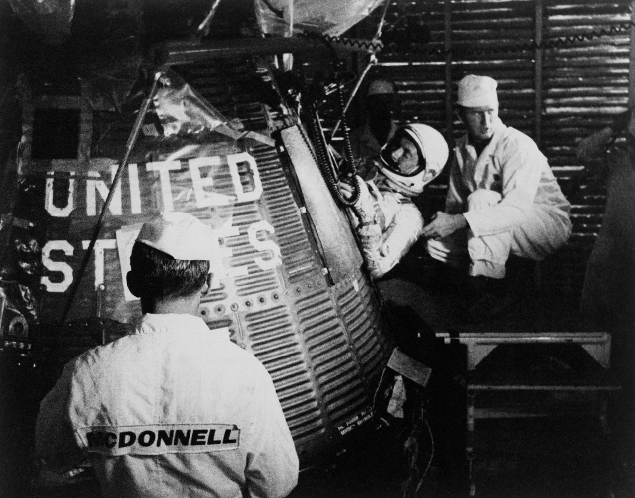 S62-04018 (24 May 1962) --- Astronaut M. Scott Carpenter is inserted inside his Aurora 7 spacecraft, before the launch of the Mercury-Atlas 7 (MA-7) mission. Photo credit: NASA