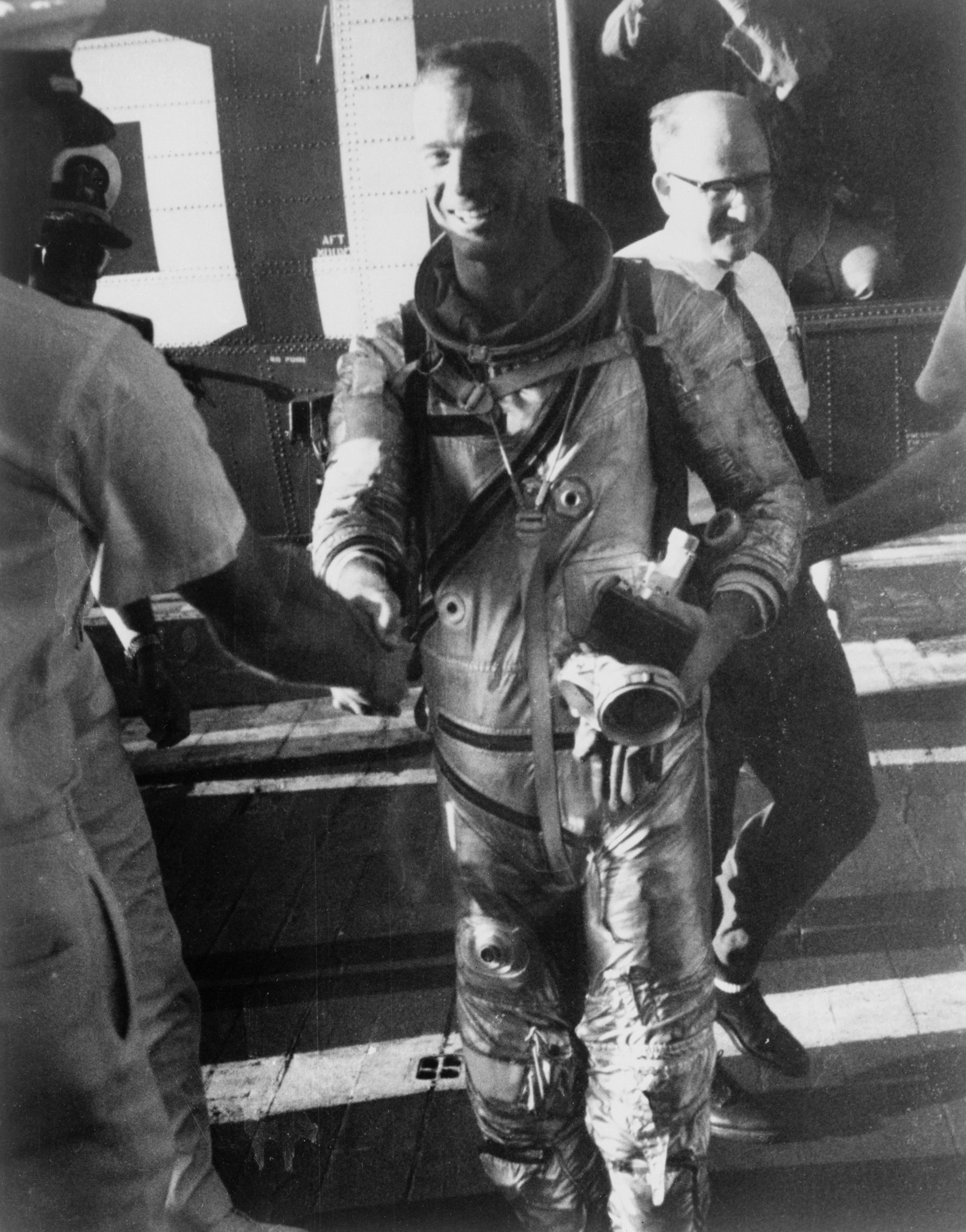 S62-04027 (24 May 1962) --- Astronaut M. Scott Carpenter, prime pilot for the Mercury-Atlas 7 (MA-7) mission, arrives aboard the prime recovery ship, USS Intrepid, during recovery operations following his Earth-orbital mission. Photo credit: NASA