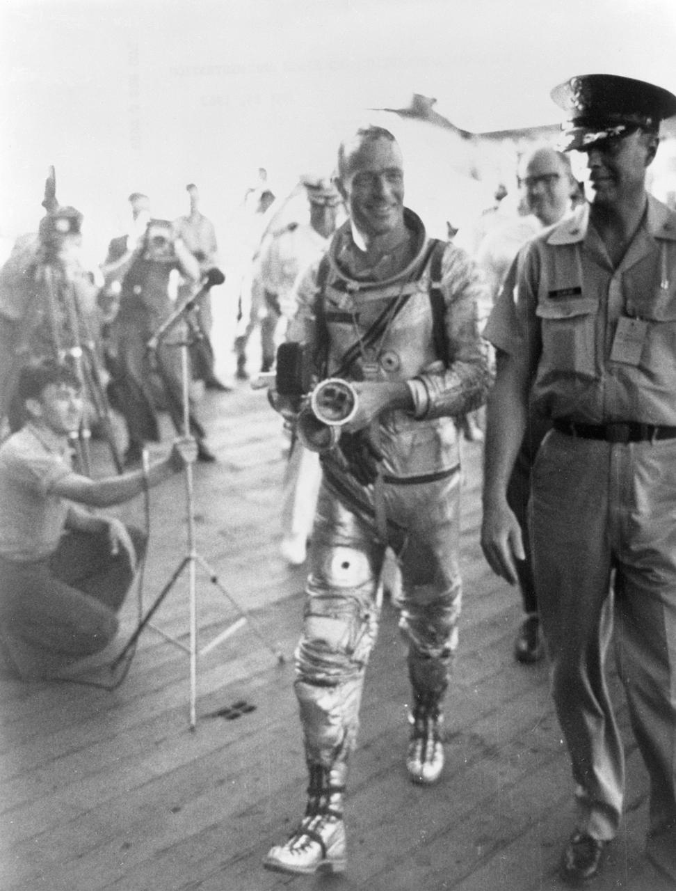 S62-04058 (24 May 1962) --- Astronaut M. Scott Carpenter, prime pilot for the Mercury-Atlas 7 (MA-7) mission, arrives aboard the prime recovery ship, USS Intrepid, during recovery operations following his Earth-orbital mission. Photo credit: NASA