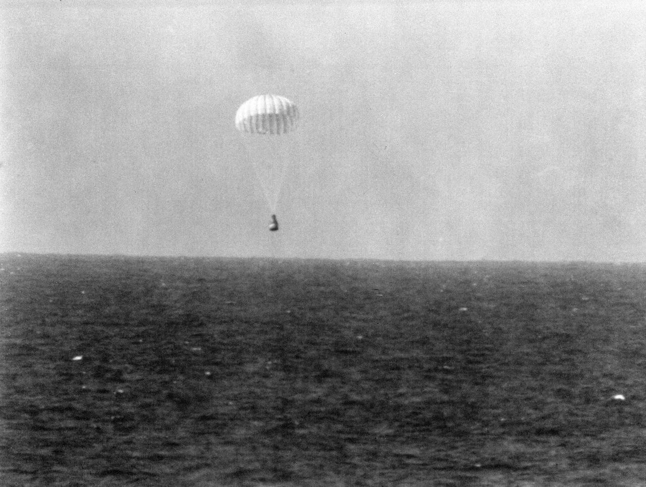 S62-04534 (3 Oct. 1962) --- Landing with parachute extended of astronaut Walter M. Schirra's Mercury-Atlas 8 (MA-8) capsule, called the Sigma 7, after a world orbital flight. Photo credit: NASA