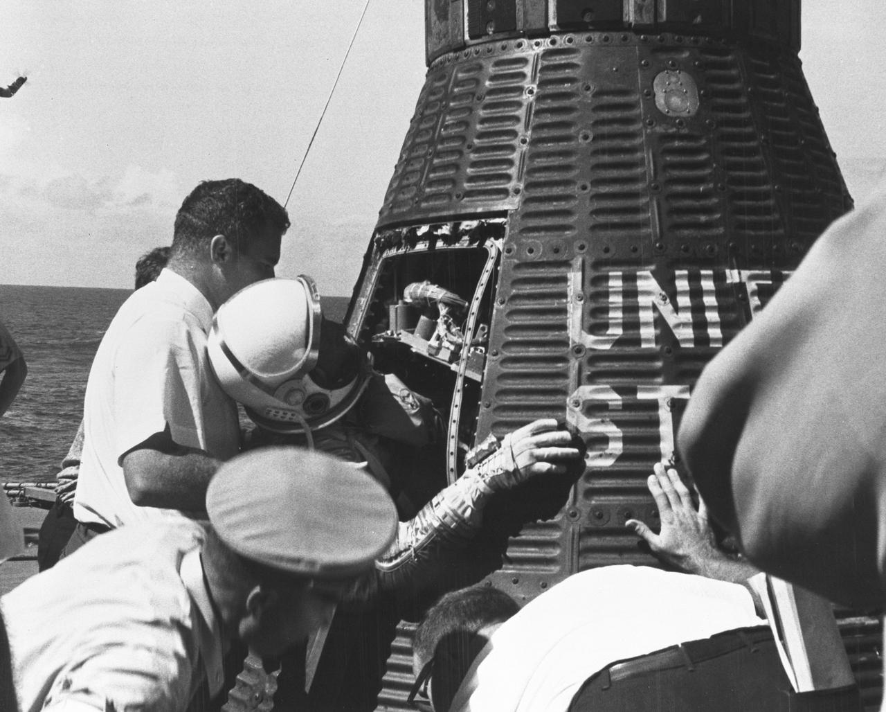 S62-06108 (3 Oct. 1962) --- Close-up view of Mercury-Atlas 8 (MA-8) astronaut Walter Schirra Jr. being removed from his Sigma 7 capsule by Navy personnel. Photo credit: NASA