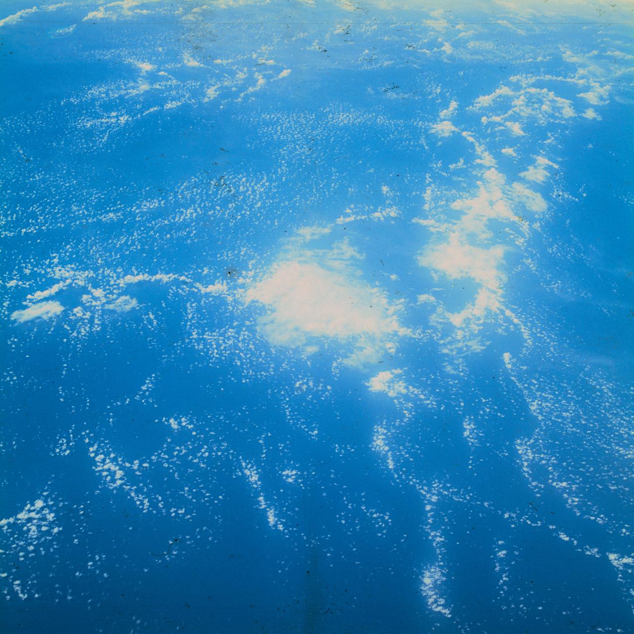 S62-06613 (3 Oct. 1962) --- Cumulus cloud formation over West Atlantic Ocean north of South American during the fourth orbit pass of the Mercury-Atlas 8 (MA-8) mission by astronaut Walter M. Schirra Jr. with a hand-held camera. Photo credit: NASA