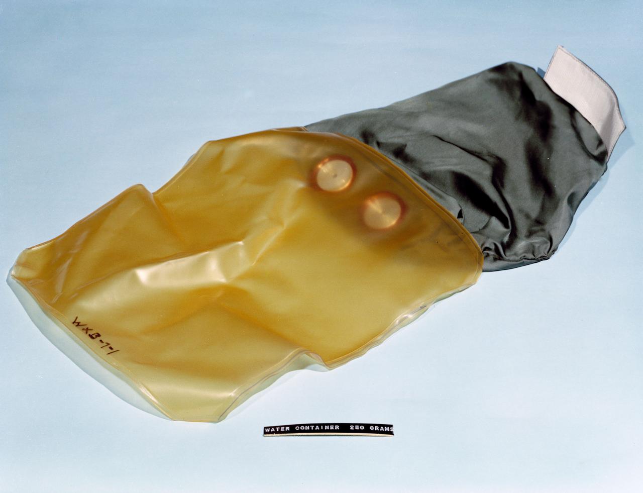 S62-06783 (1962) --- Component of Mercury astronauts survival equipment backpack - water container holding 250 grams when full. Photo credit: NASA