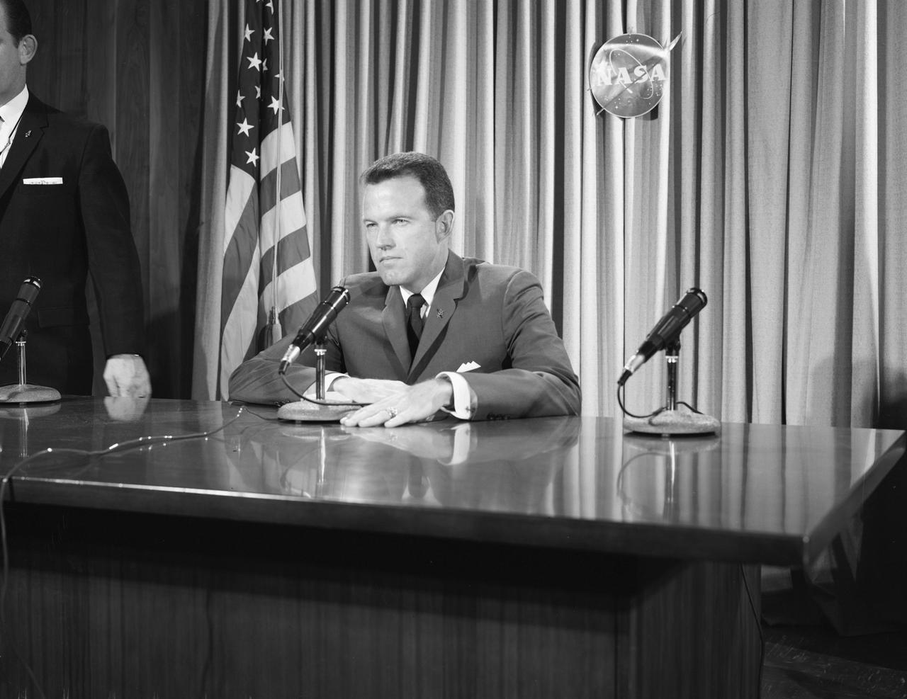 S63-00581 (1963) --- Astronaut L. Gordon Cooper Jr., pilot of the Mercury Atlas 9 (MA-9) space mission, appears before newsmen at a preflight press conference. Photo credit: NASA