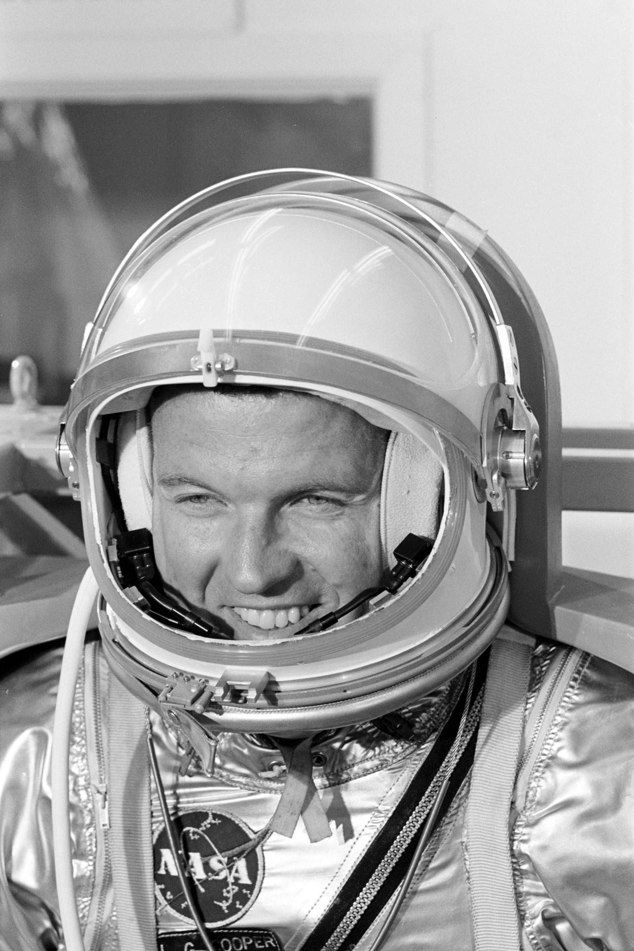 Astronaut L. Gordon Cooper smiles while wearing his Mercury space suit.