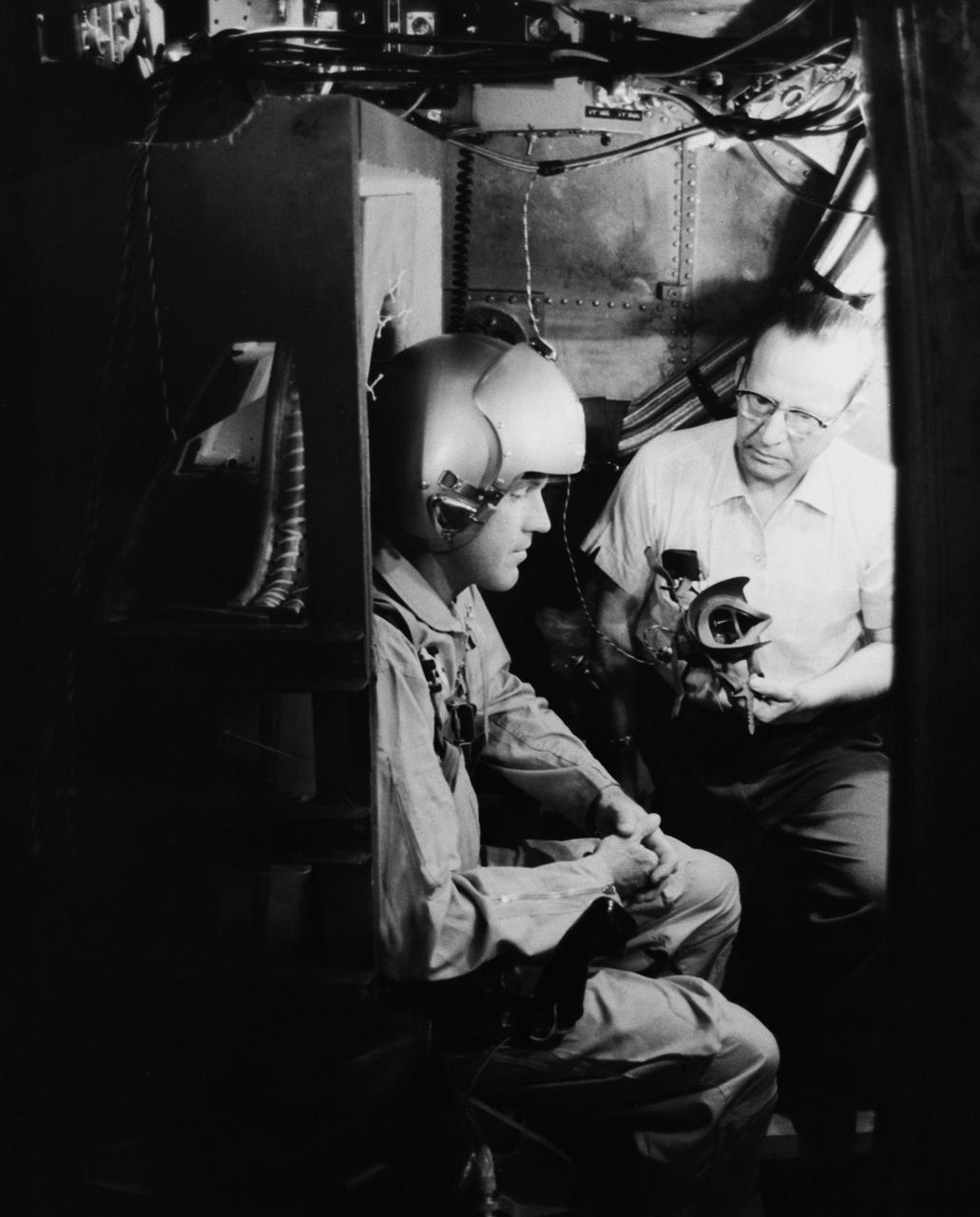 S63-03978 (1963) --- Astronaut L. Gordon Cooper Jr., prime pilot for the Mercury-Atlas 9 (MA-9) mission, is strapped into the gondola while undergoing tests in the centrifuge at the Naval Air Development Center, Johnsville, Pennsylvania. The centrifuge is used to investigate by simulation the pilot's capability to control the vehicle during the actual flight in its booster and reentry profile. Photo credit: NASA