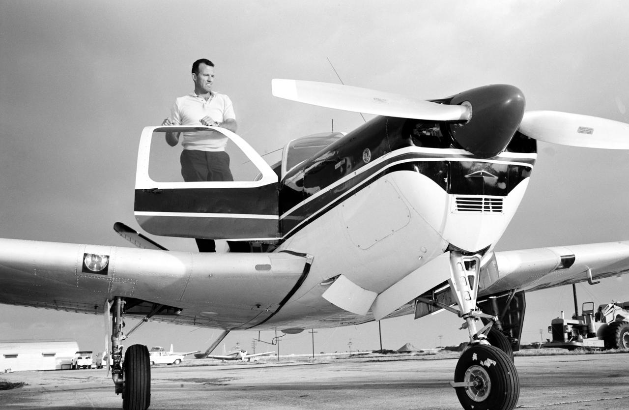 S63-03989 (1963) --- Astronaut L. Gordon Cooper Jr., prime pilot for the Mercury Atlas 9 (MA-9) 22-orbit flight, stands by his privately owned Beechcraft Bonanza aircraft, at Patrick Air Base, Florida. Photo credit: NASA