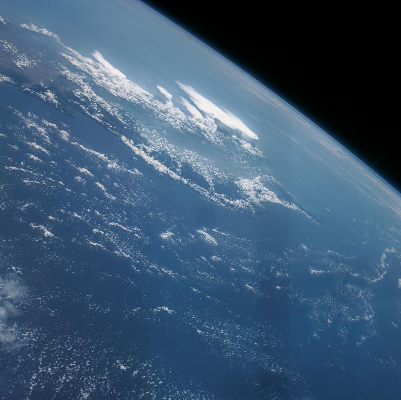 S63-06437 (15-16 May 1963) --- The southern portion of the island of Taiwan (Formosa), Formosa Straight and the Pacific Ocean, looking northeast, as photographed from the Mercury-Atlas 9 (MA-9) capsule by astronaut L. Gordon Cooper Jr., during his 22-orbit MA-9 spaceflight. Photo credit: NASA