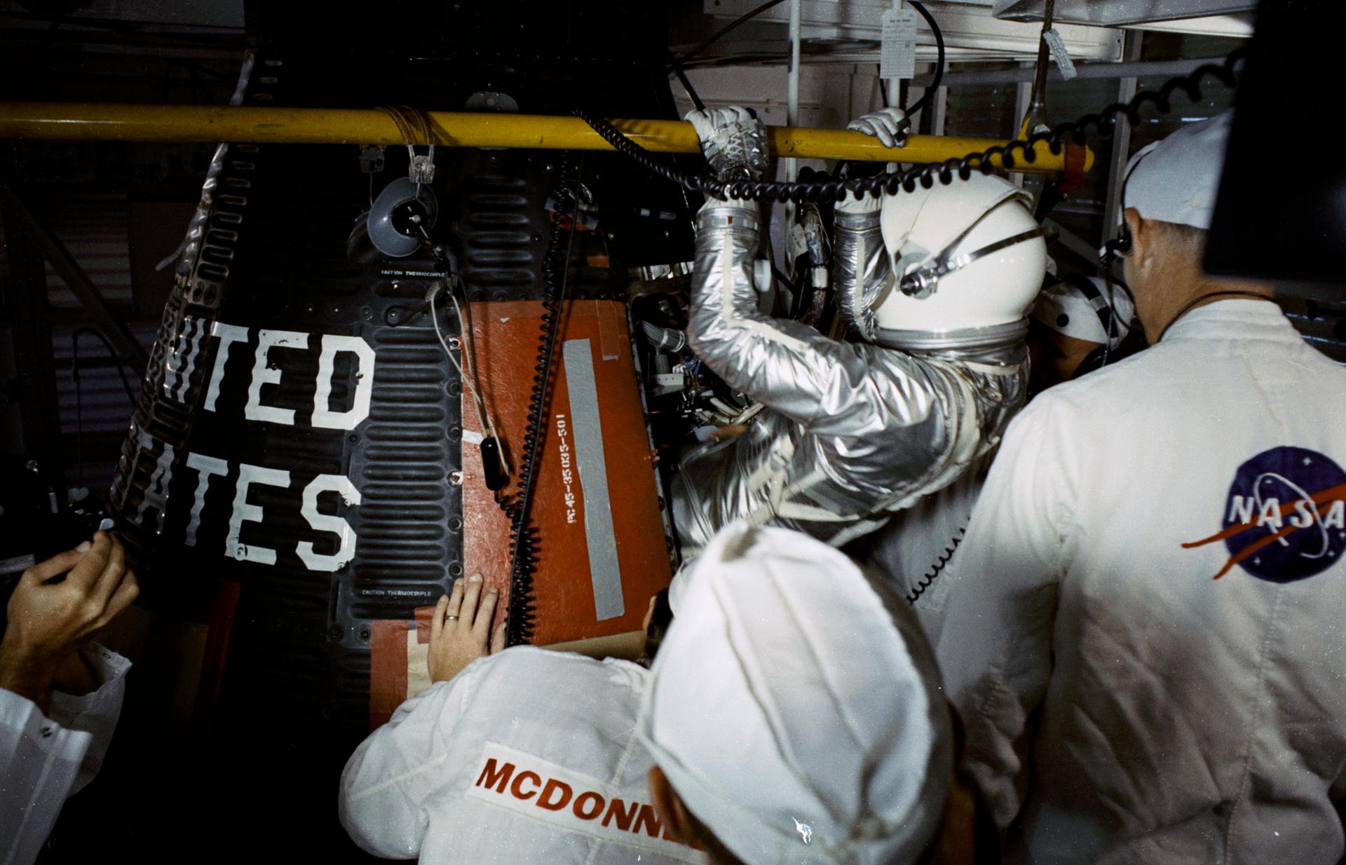 Gordon Cooper enters the Faith 7 spacecraft.