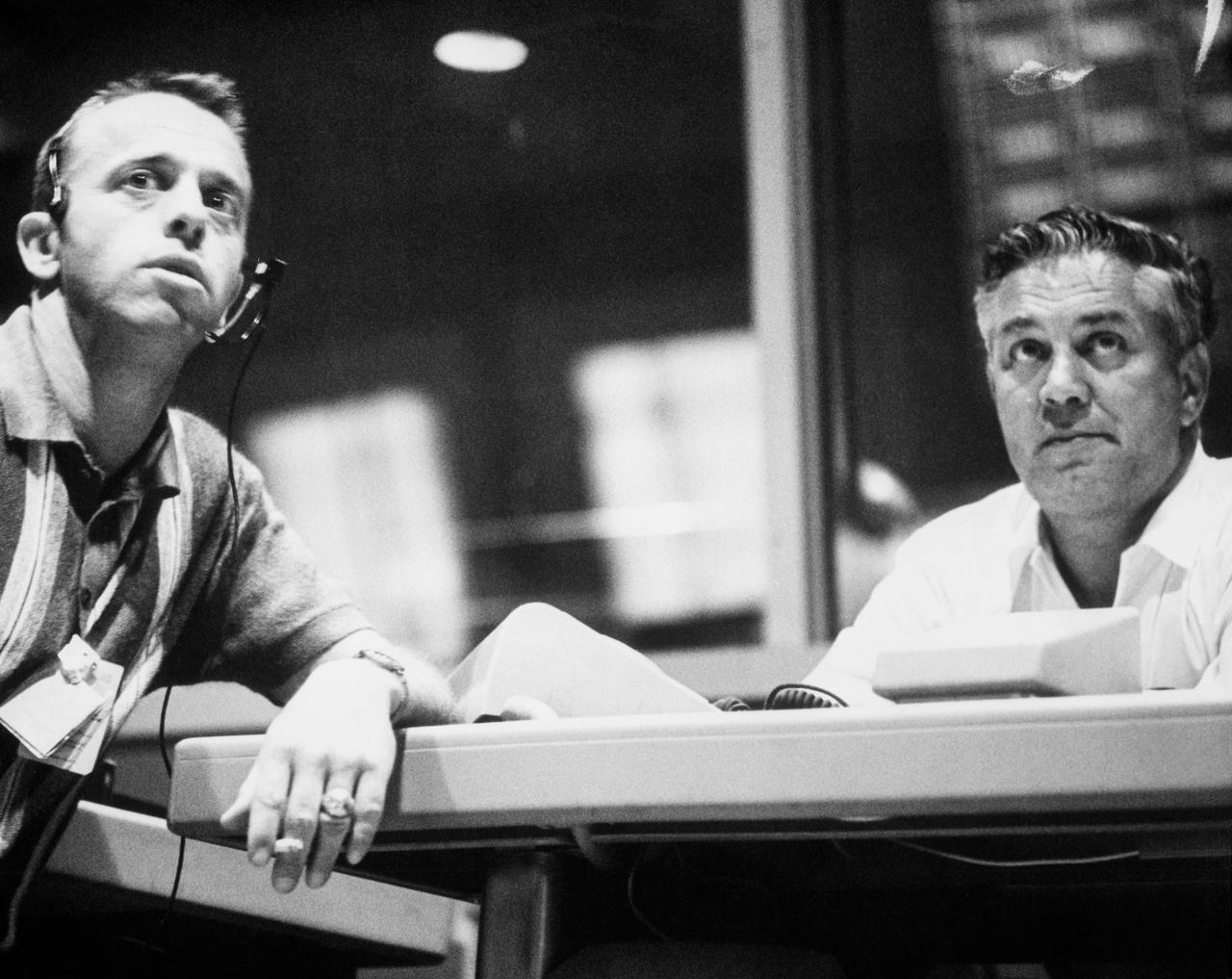 S63-07857 (15-16 May 1963) --- Astronaut Alan Shepard (left) and Walter C. Williams monitor progress of the Mercury Atlas 9 (MA-9) mission from Mercury Control Center, Cape Canaveral, Florida. Photo credit: NASA