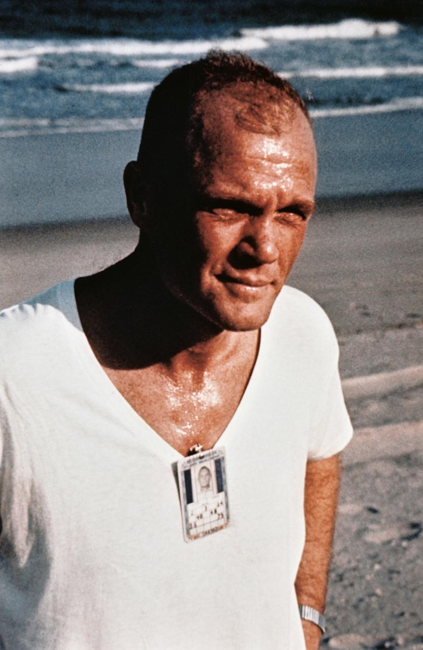S64-14883 (1962) --- Astronaut John H. Glenn Jr., pilot of the Mercury-Atlas 6 mission, participates in a strict physical training program, as he exemplifies by frequent running. Here he pauses during an exercise period on the beach near Cape Canaveral, Florida. Photo credit: NASA