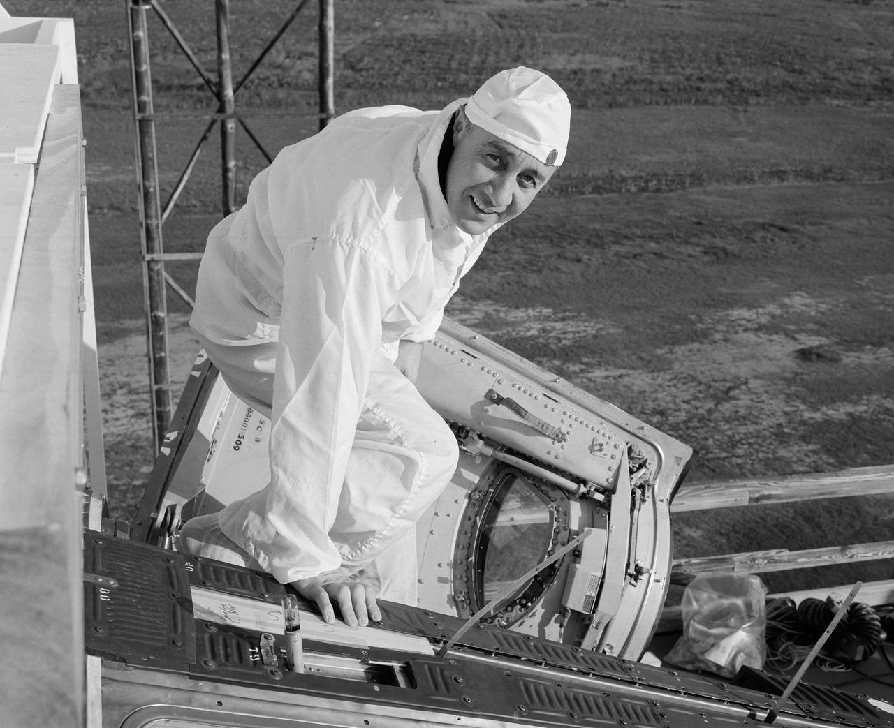 S65-13243 (6 Jan. 1965) --- Astronaut Virgil I. Grissom, Gemini-Titan 3 command pilot, is shown entering the Gemini-3 spacecraft for a communications test at the Merritt Island launch area.