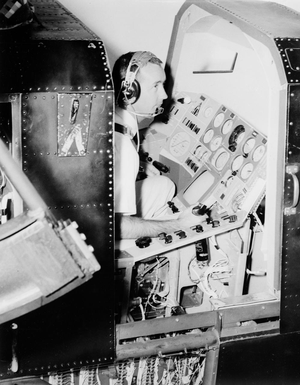 S65-19472 (10 May 1965) --- Astronaut James A. McDivitt is shown in the gondola of a realistic manned spaceflight simulator developed by the Astronautics Division of Ling-Temco-Vought in Dallas, Texas.