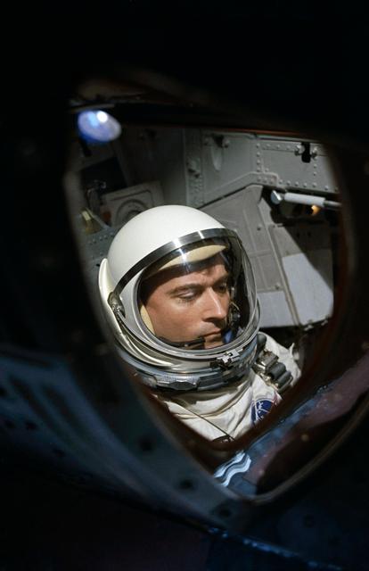 NASA image: View of Astronaut John Young through spacecraft window prior to launch