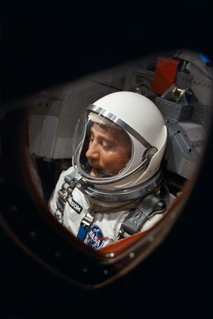 NASA image: View of Astronaut Virgil Grissom through spacecraft window prior to launch