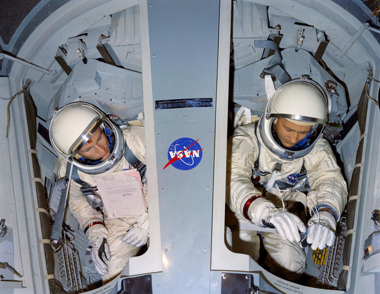 Astronauts Edward H. White II and James A. McDivitt are shown going through tests in a Gemini Crew Simulator at the Cape. CAPE KENNEDY, FL CN