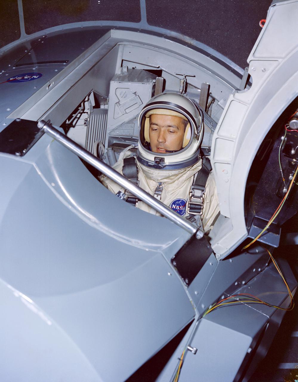 Astronauts James A. McDivitt and Edward H. White II, are shown going through tests in a Gemini Crew Simulator at the Cape. CAPE KENNEDY, FL CN