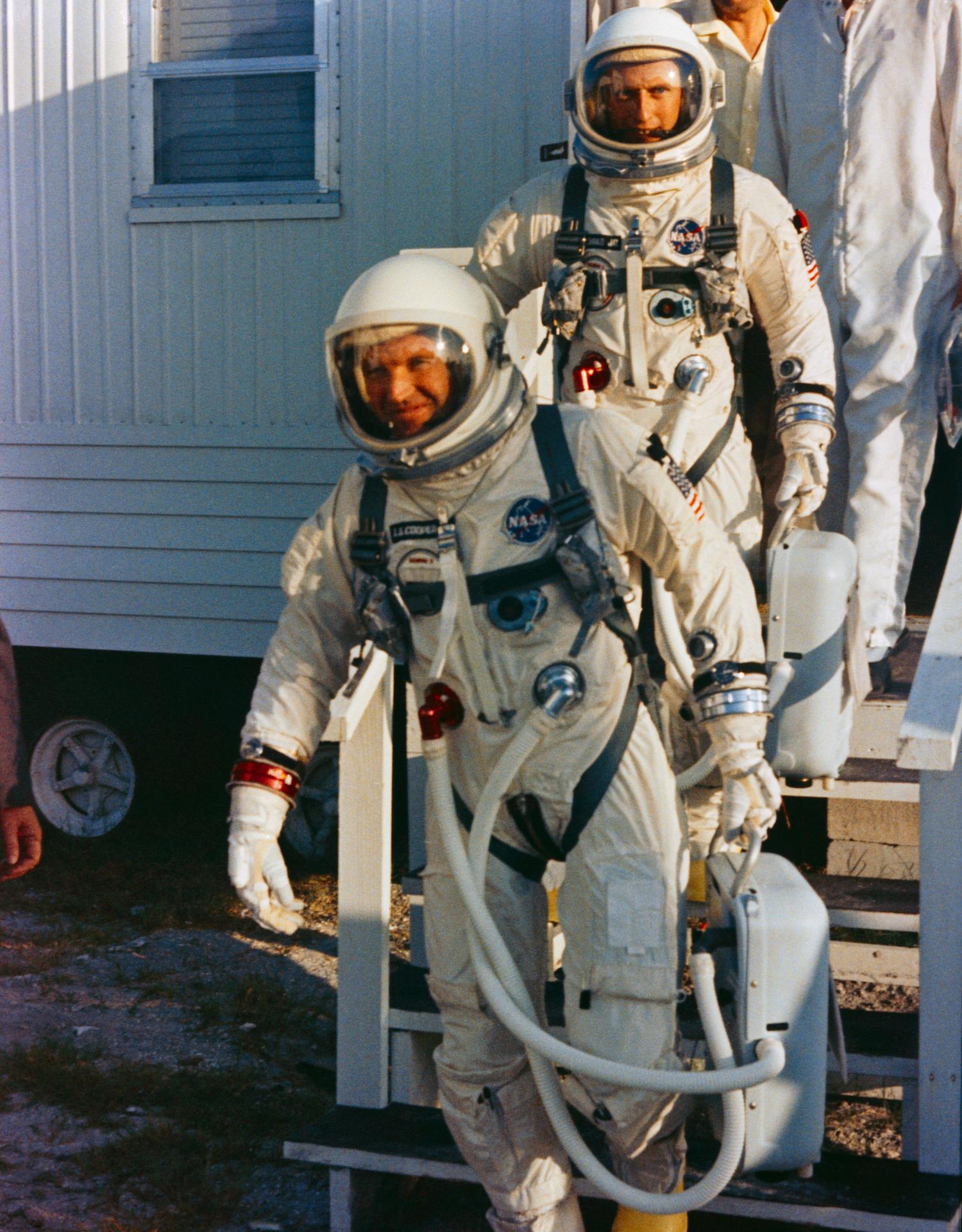 Gordon Cooper and Pete Conrad leave the suiting trailer on their launch day for Gemini 5.