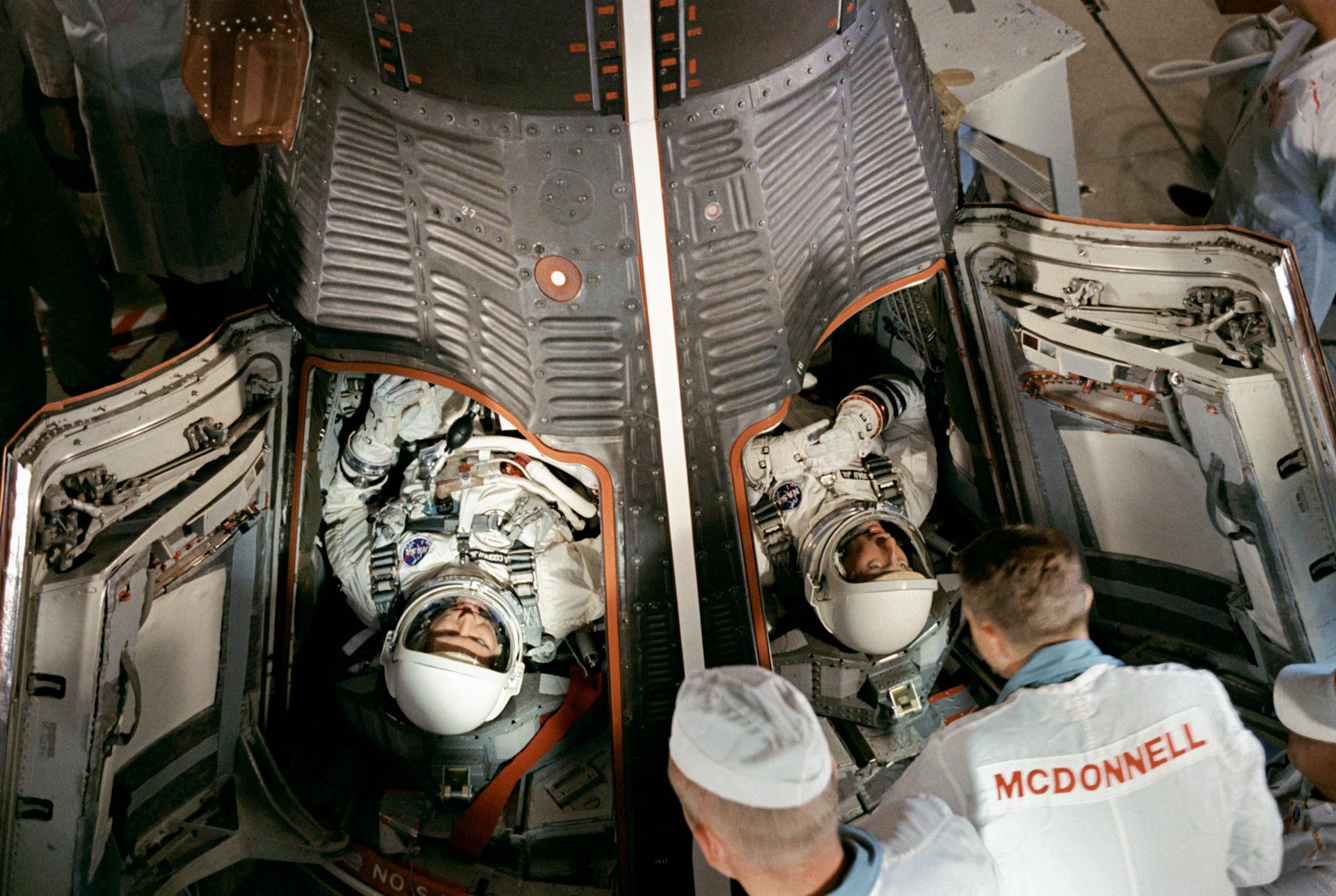 Gordon Cooper and Pete Conrad are seen situated in the Gemini V spacecraft prior to launch on 21 August 1965.