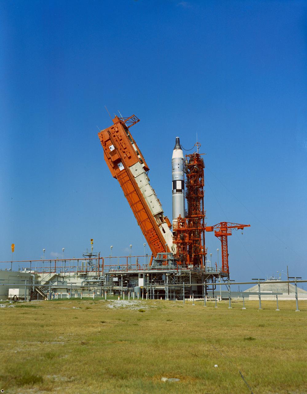 S65-29648 (3 June 1965) --- View of the Gemini-Titan 4 spacecraft on Pad 19 on day of launch with erector being removed.
