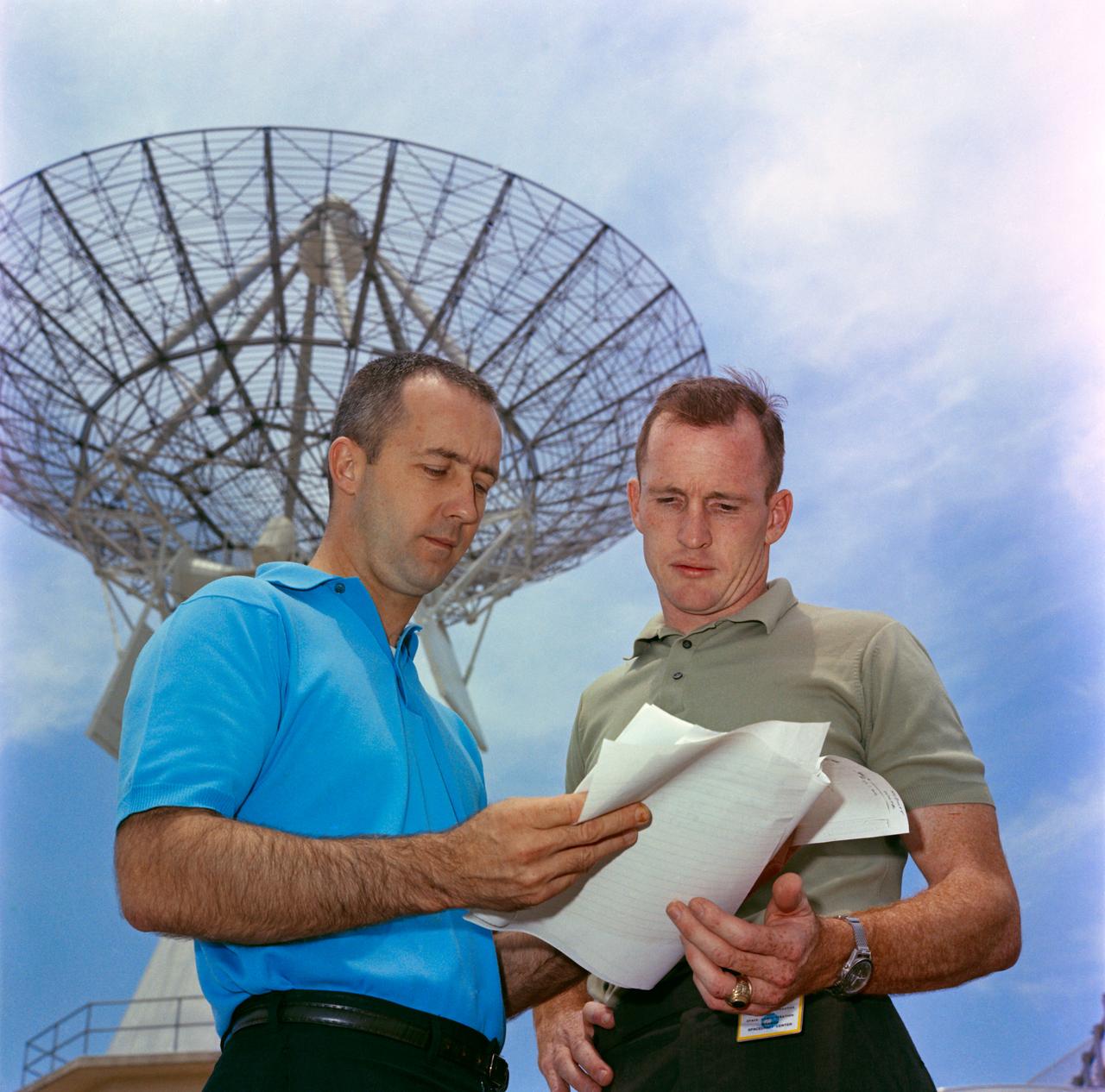 S65-29655 (7 May 1965) --- Astronauts James A. McDivitt (left) and Edward H. White II, Gemini-4 prime crew, are shown looking over training plans at Cape Kennedy during prelaunch preparations. The NASA Headquarters alternative photo number is 65-H-275.