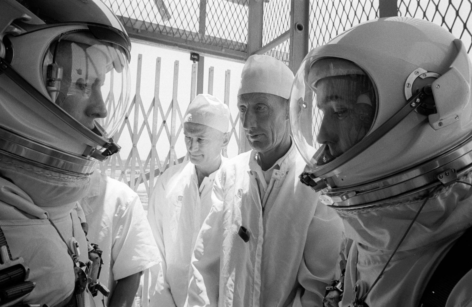 The Gemini 4 prime crew ride the elevator for a launch simulation