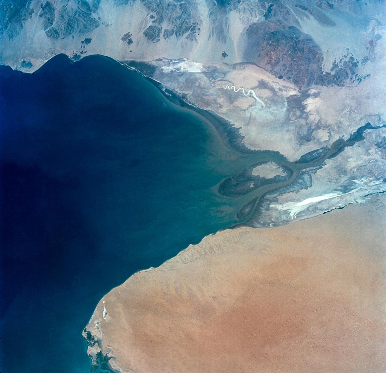 S65-34673 (3-7 June 1965) --- This photograph shows the north end of the Gulf of California at the mouth of the Colorado River as it was seen from the Gemini-4 spacecraft during orbital flight June 3-7, 1965. This picture was part of the Synoptic Terrain Photography experiments conducted during the flight to obtain high quality photographs of large land areas already mapped by aerial photography. In charge of these experiments was Dr. Paul D. Lowman Jr., NASA geologist from Goddard Space Flight Center, Greenbelt, Md. This picture was taken with a modified 70mm Hasselblad camera using Eastman color film, ASA 64 at a lens setting of 250th of a second at f/11.
