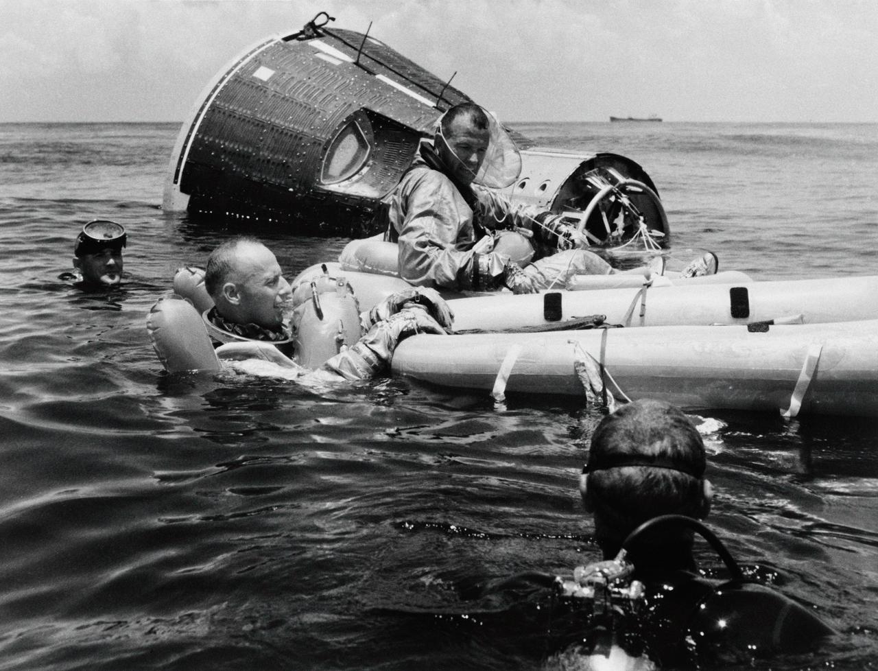 S65-39907 (21 July 1965) --- Prime crew for the Gemini-Titan 5 (GT-5) spaceflight, astronauts Charles Conrad Jr. (in water) and L. Gordon Cooper Jr. (in raft) practice survival techniques following successful egress from their Gemini Static Article 5 spacecraft in the Gulf of Mexico. Cooper is command pilot and Conrad is pilot for the GT-5 mission.