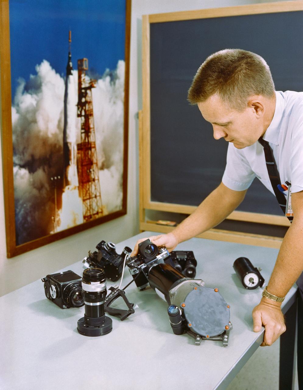 S65-43482 (20 Aug. 1965) --- Table-top view of several of the optical and photographic pieces of equipment planned for use on the Gemini-5 spacecraft before installation in the spacecraft.