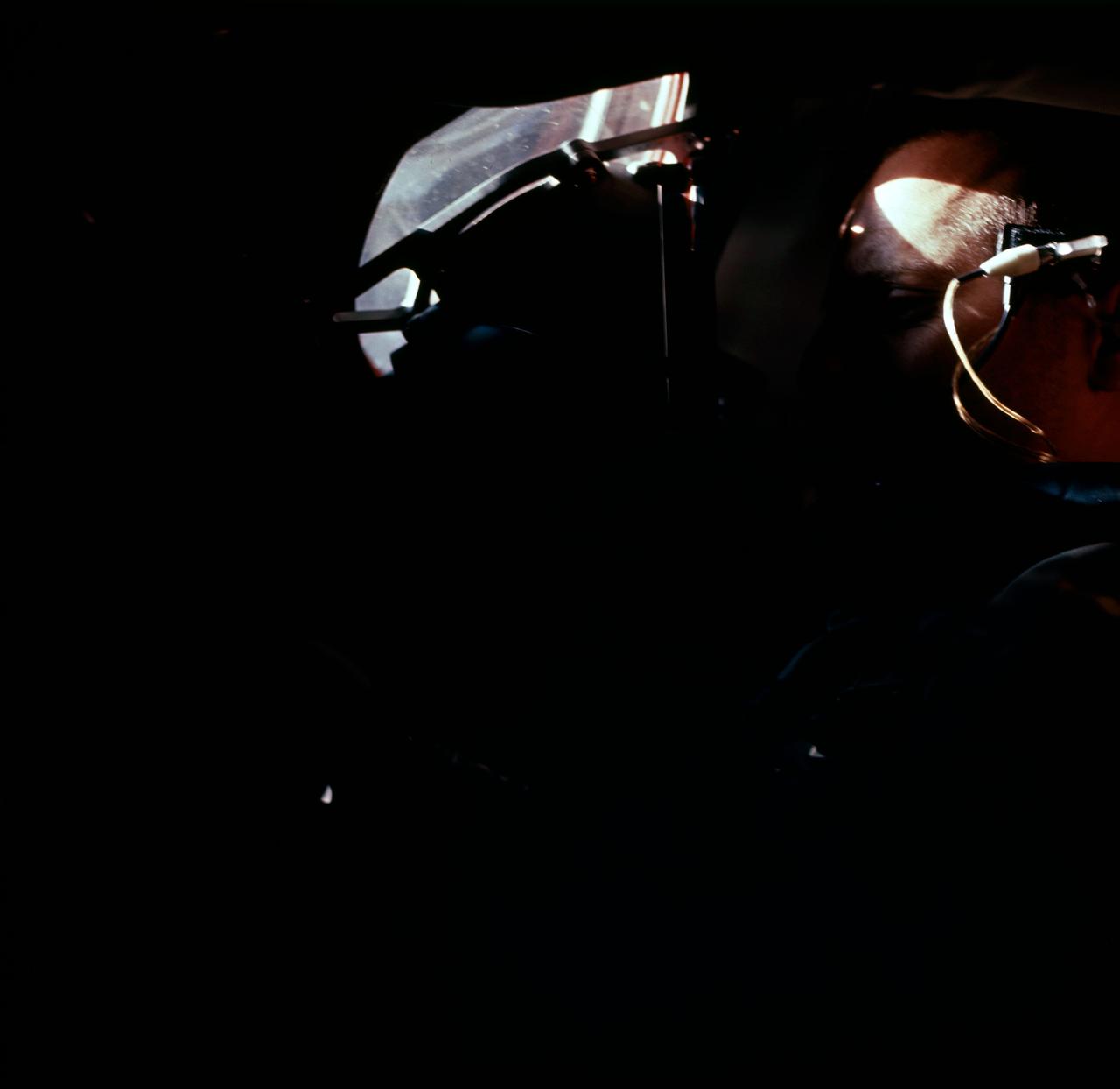 S65-45610 (21 Aug. 1965) --- Astronaut Charles Conrad Jr. as seen through the Gemini-5 spacecraft window before launch.