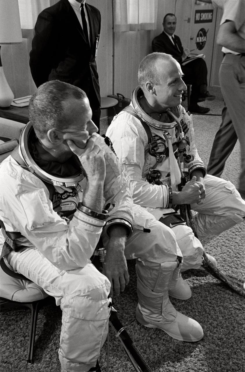S65-46367 (19 Aug. 1965) --- Astronauts Charles Conrad Jr. (right) and L. Gordon Cooper Jr. are pictured during suiting up operations before Gemini-5 spaceflight. Editor's note: The scheduled Aug. 19 launch was postponed due to weather conditions and problems with loading cryogenic fuel for the fuel cell. The launch occurred on Aug. 21, 1965.
